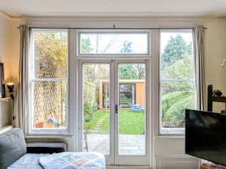 WindowSkins installation on a pair of French Doors with adjoining Sash Windows
