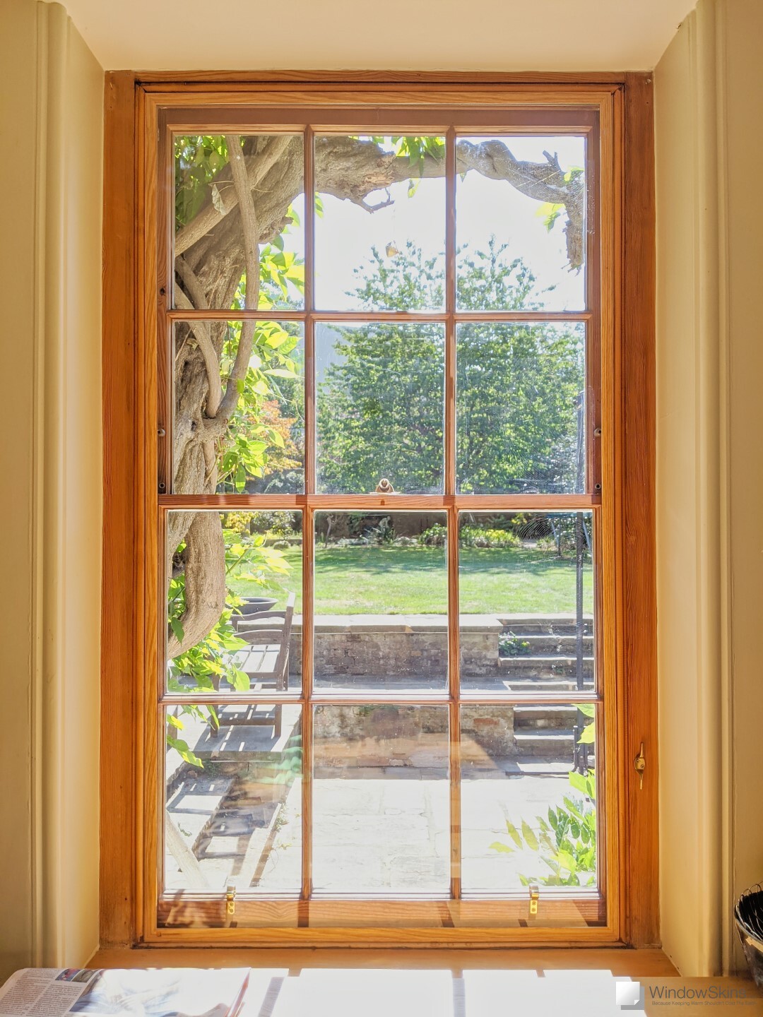 Varnished sash window fitted with colour matched WindowSkins using the Subframe placement