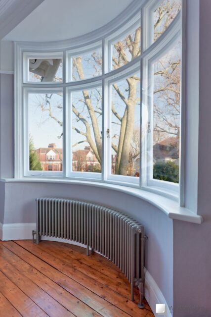 Side view of curved casement windows fitted with WindowSkins secondary glazing in the Outer placement