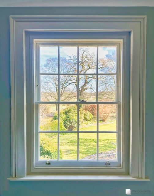 colour matched magnetic secondary glazing (WindowSkin) fitted to a sash window in the outer placement