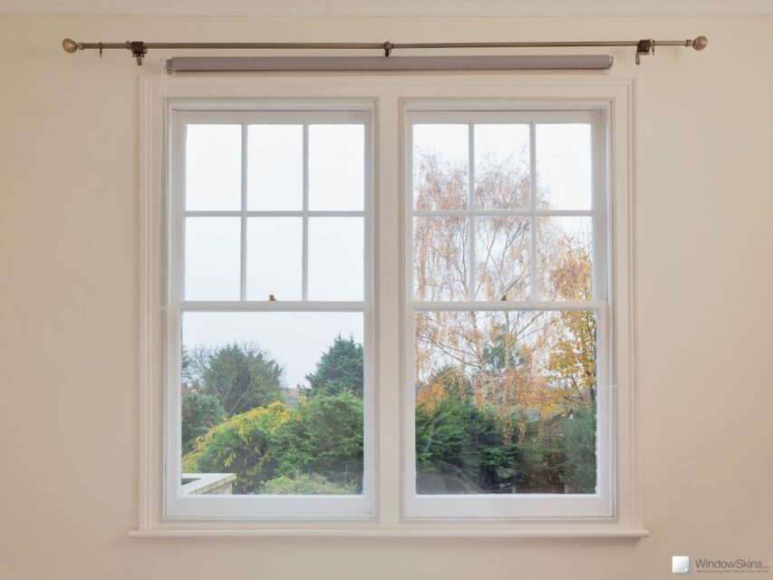 Two bedroom sash windows with a WindowSkins secondary glazing panel fitted in the Outer position