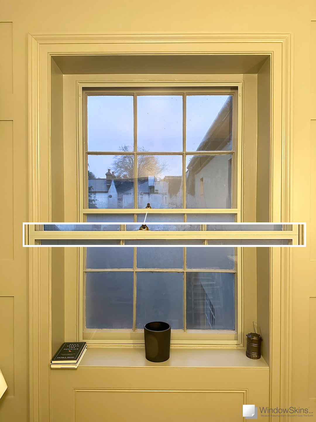 Closeup of the Split Panel on a colour matched Sash WindowSkin (fitted using the Subframe placement)