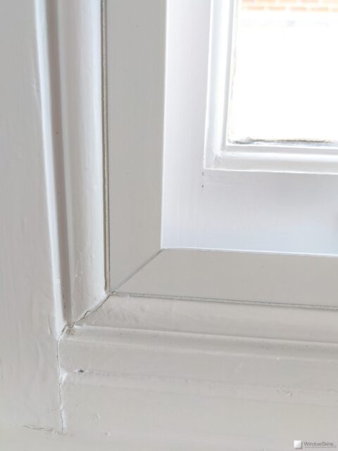 Closeup of a colour matched WindowSkins secondary glazing subframe fit to a sash window staff bead
