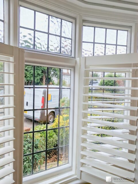 WindowSkins magnetic secondary glazing fit to leaded timber casement windows with white Caf&eacute; style plantation shutters