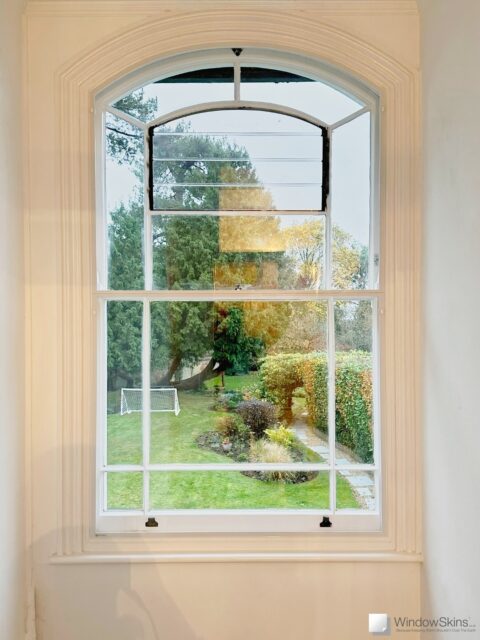 IMG_9514 (QHD) Split panel magnetic secondary glazing fitted to an arched sash window using a bespoke curved subframe