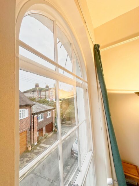 IMG_5128 (QHD) Side view of three section magnetic secondary glazing fitted to a tall arched sash window with bespoke curved subframe
