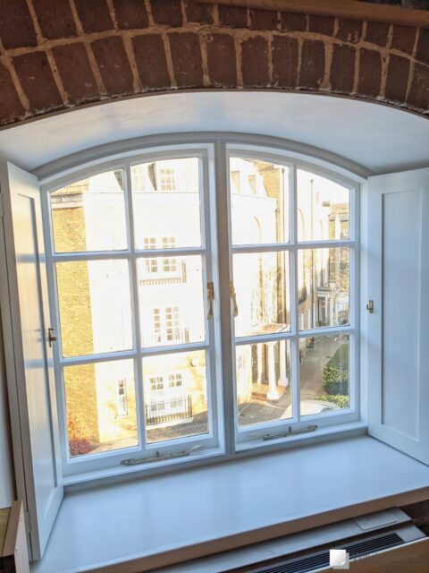 PXL_20211123_140340867 (QHD) WindowSkins magnetic secondary glazing fit to an arched casement window with panel shutters