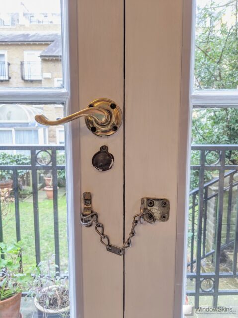 Closeup of French doors retrofit with magnetic secondary glazing panels