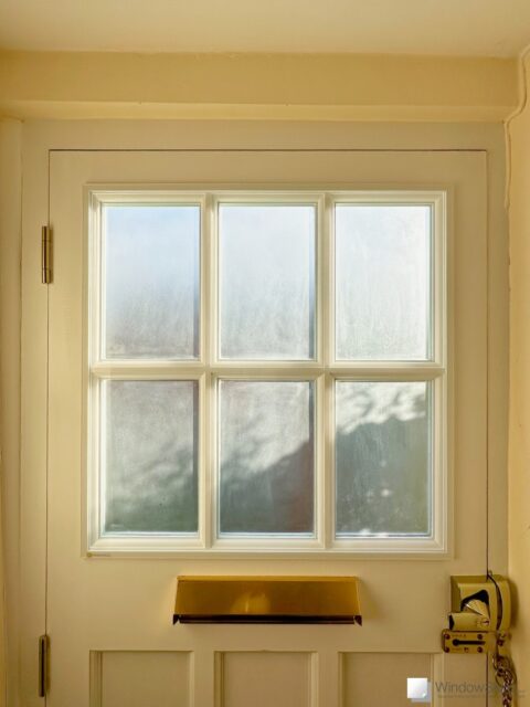 Front door with WindowSkins magnetic secondary glazing panel fitted to reduce cold, draught, condensation and noise