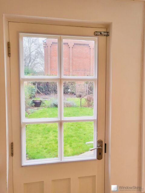 Simple Garden Door with magnetic secondary glazing retrofit to cover the single paned glass