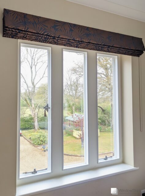 Three white stone mullion windows fitted with WindowSkins magnetic secondary glazing