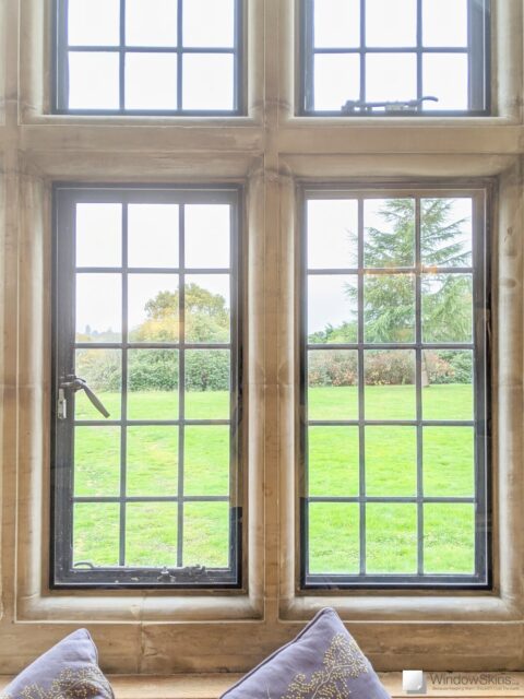 Secondary double glazing fitted using bespoke subframes mounted to stone mullion windows and leaded lights