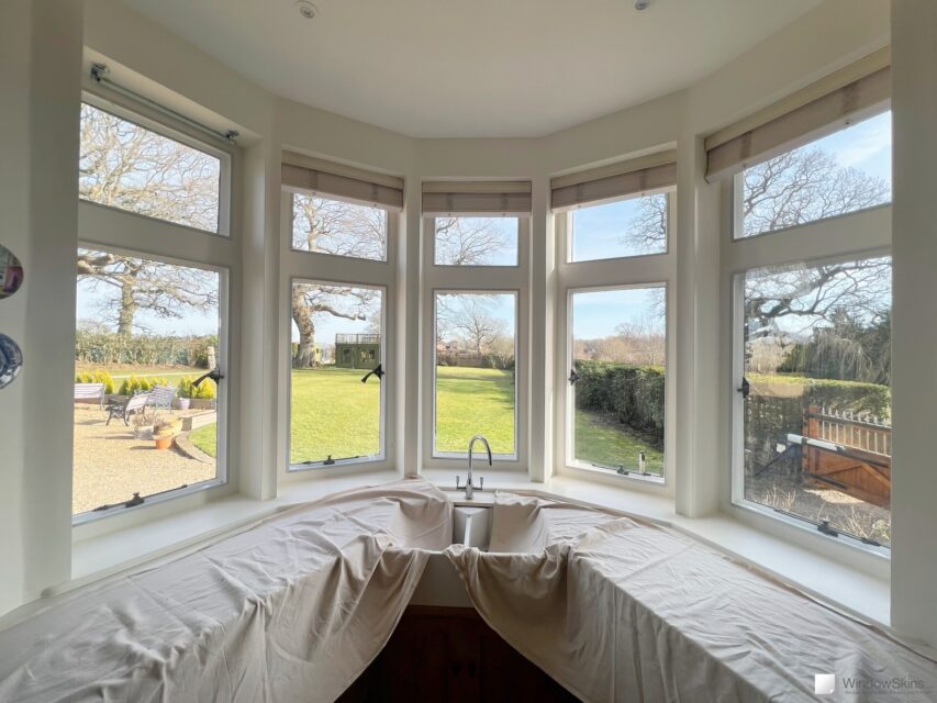 Painted stone mullion windows fitted with WindowSkins magnetic secondary glazing