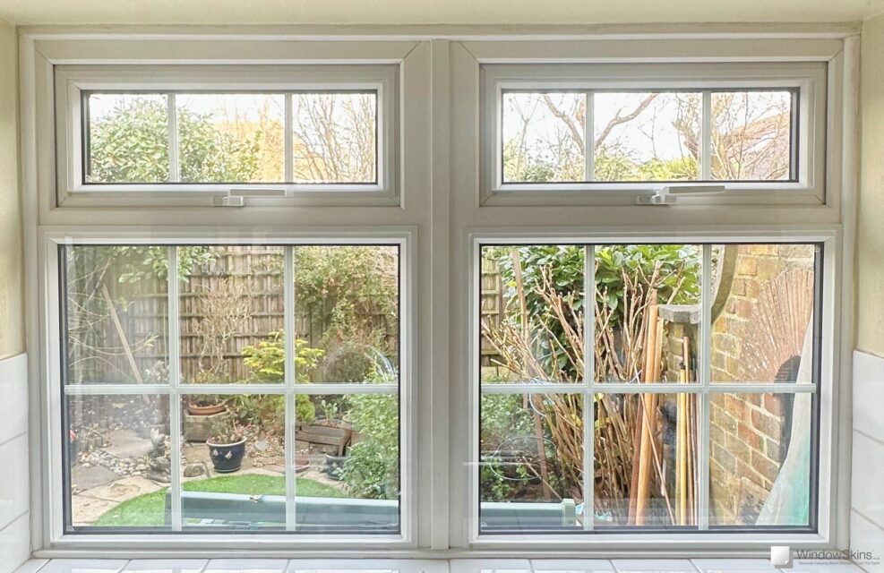 Magnetic secondary glazing installed on traditional multi-pane uPVC windows creating a triple glazed effect