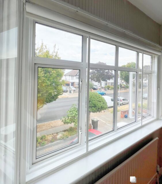 Magnetic secondary glazing fitted to a street-facing double glazed uPVC window to reduce traffic noise and heat loss