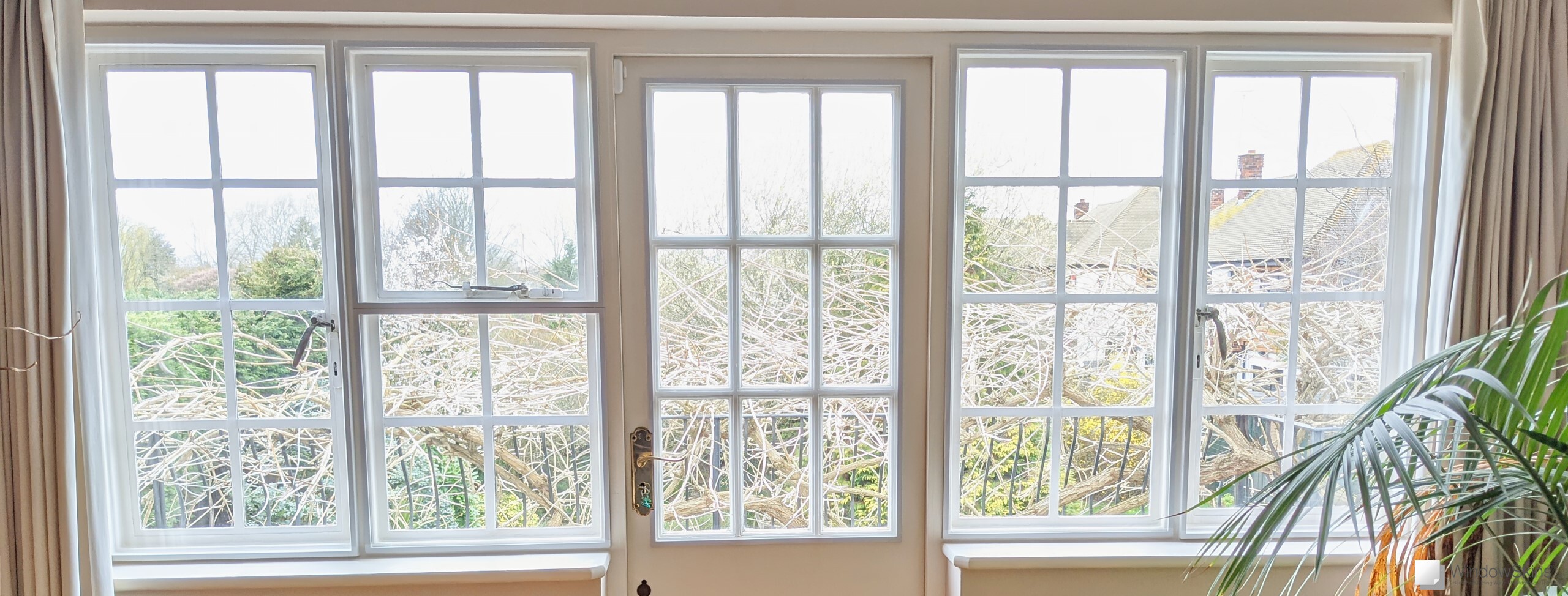 Magnetic secondary glazing fitted on timber framed steel windows and centre balcony door