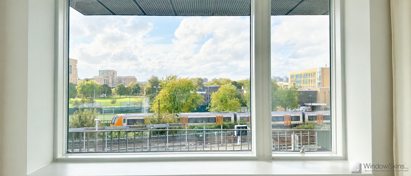 Magnetic secondary double glazing installed on a new-build uPVC window near railway line for noise reduction and sound insulation